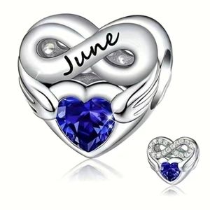 June Birthstone charm with blue rhinestone, back has rhinestone infinity symbol